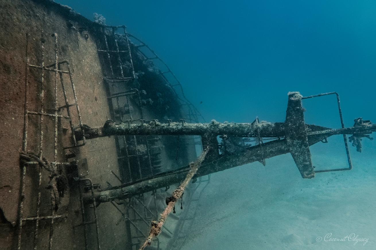 Diver by shipwreck mast
