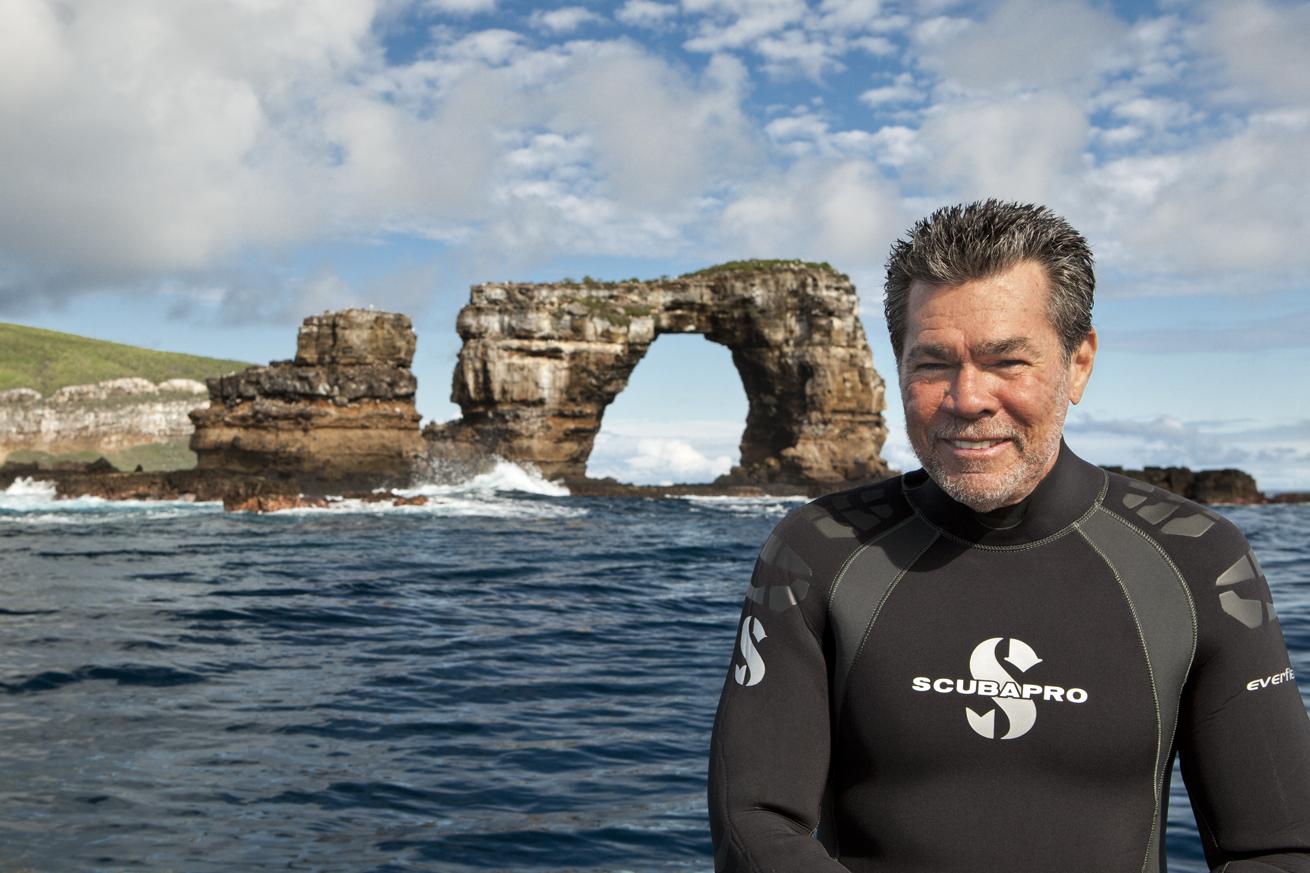 Hughes in front of Darwin’s Arch, Galapagos Islands, which collapsed in 2021 and is now known as Darwin’s Pillars.