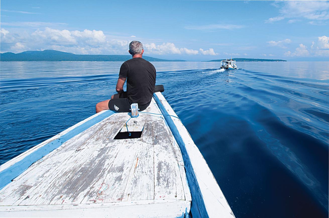 A solo diver overlooking the waters of Bali 
