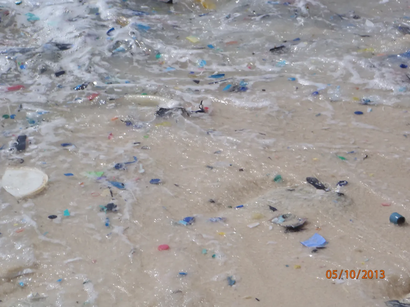 Plastic fragments washing in the surf on Christmas Island, in the northeastern Indian Ocean.