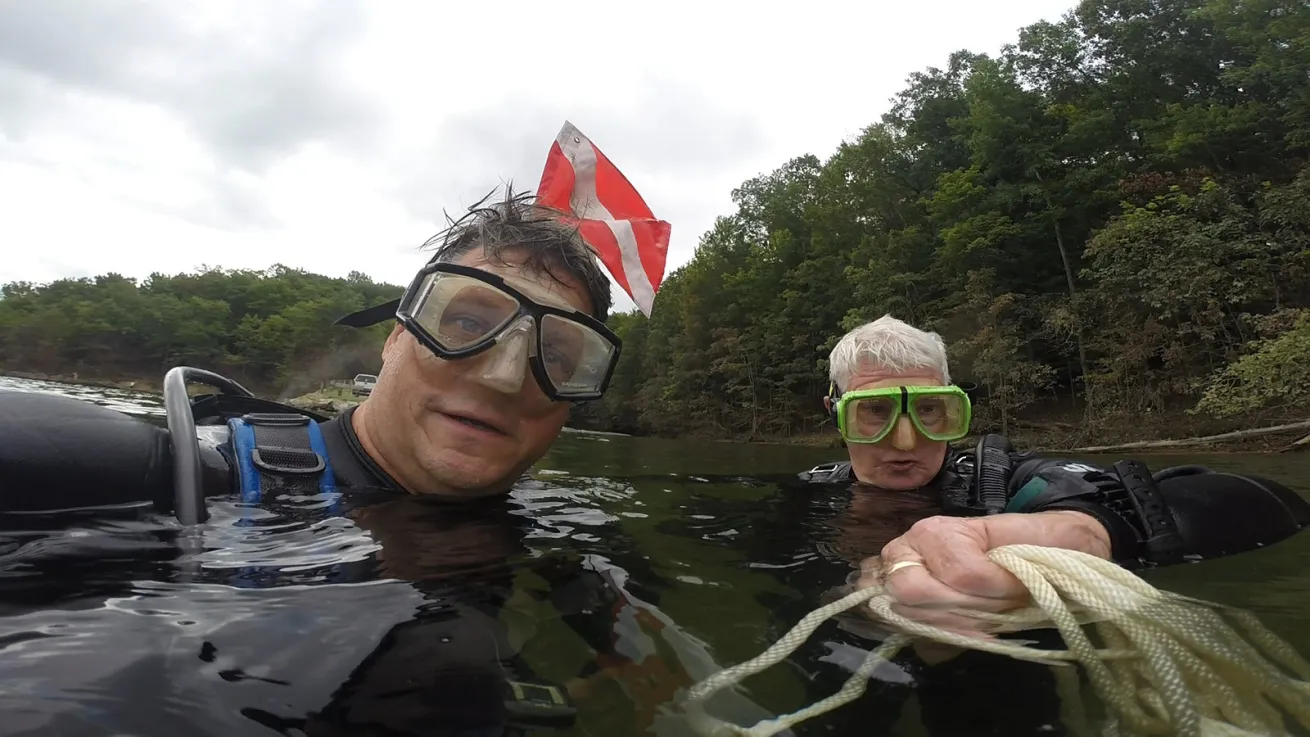 scuba divers at the surface