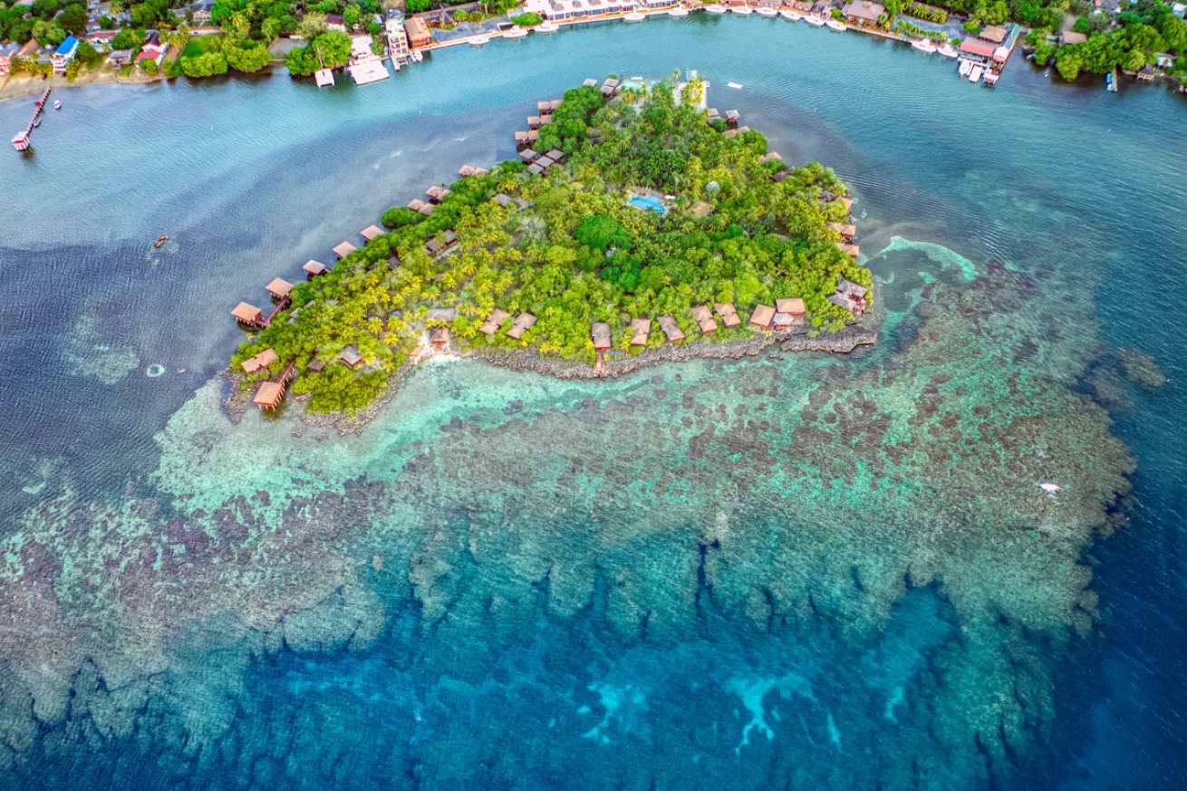 Ariel shot of the AKR island with bungalows on it.