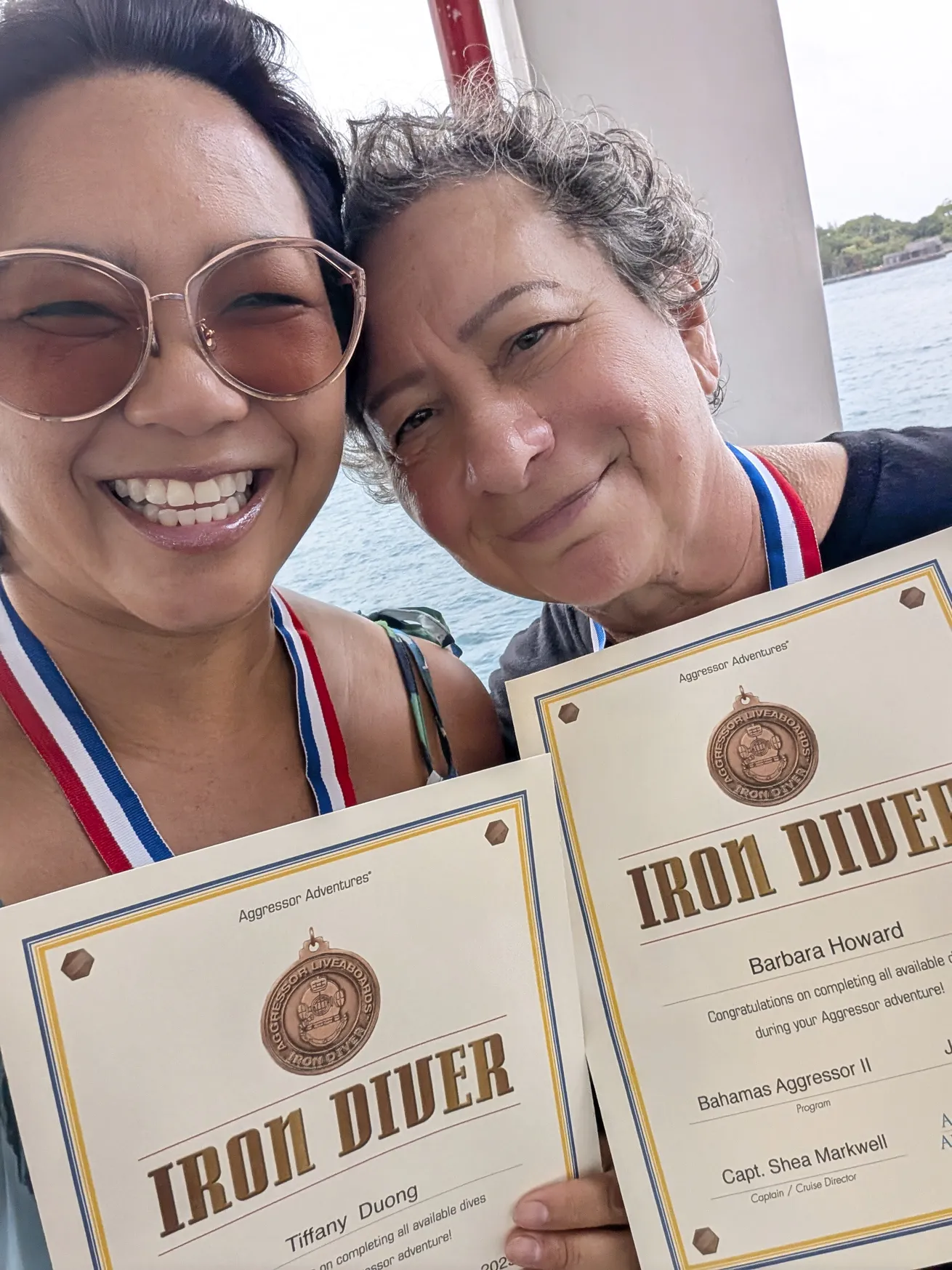The author and her buddy celebrate completing every dive offered on the trip.