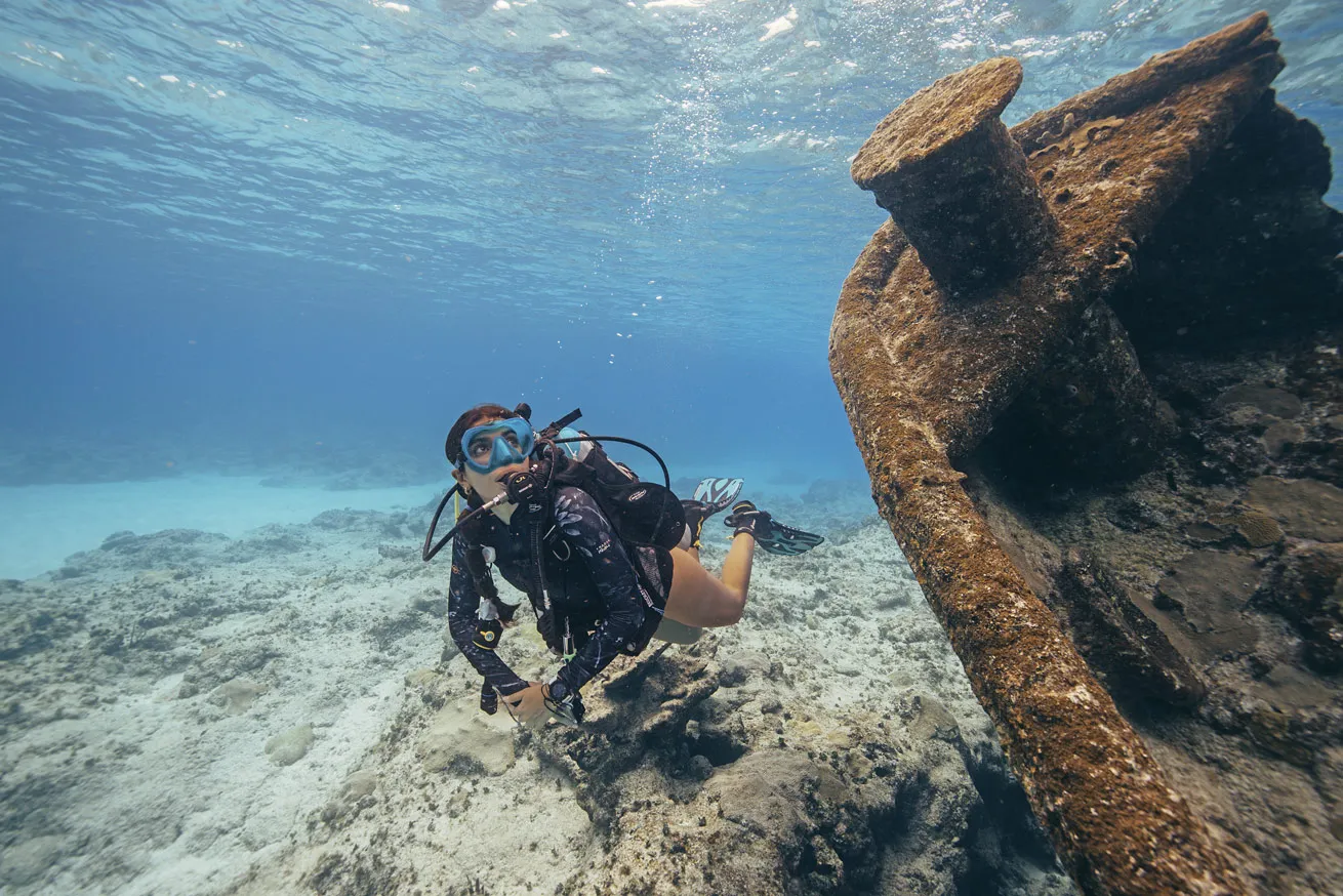 A diver checks out a small wreck near Blue Wall.

