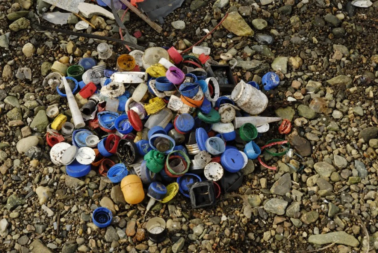 plastic bottle caps on beach