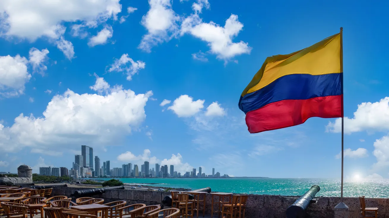 flag of colombia with cartagena in background