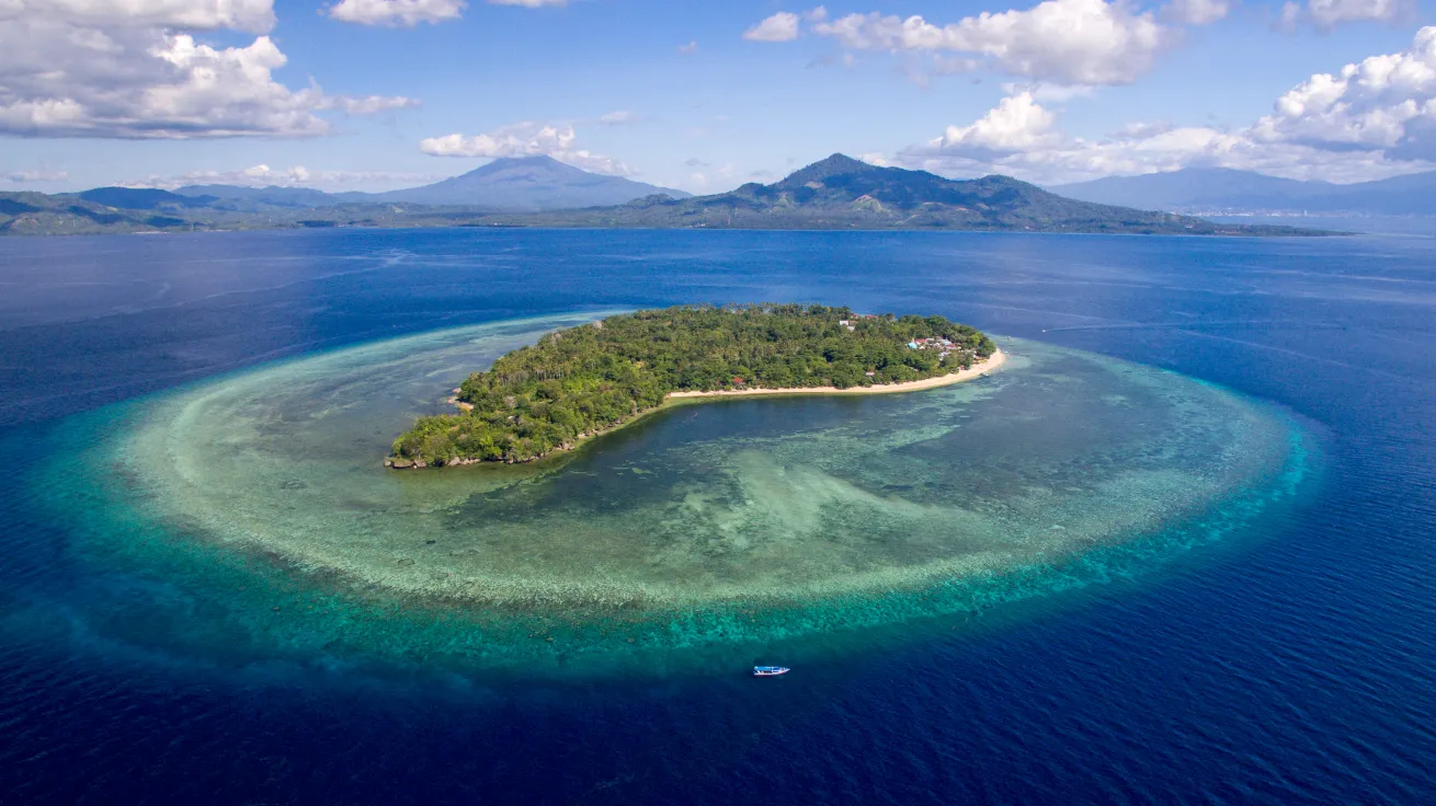 The boutique resort is located on the edge of Pulau Siladen’s white-sand beaches.