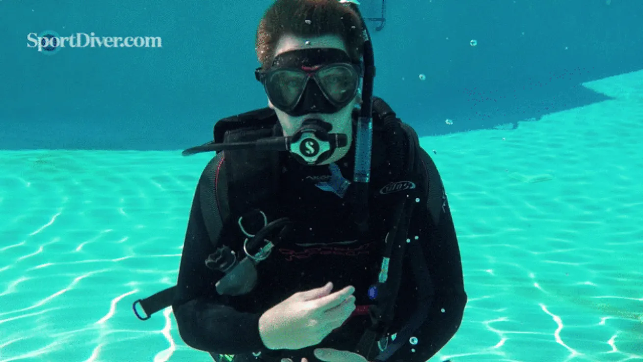 scuba hand signals vomit