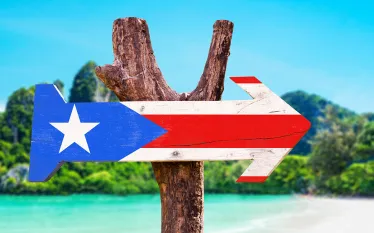 puerto-rico-flag-wooden-arrow-shutterstock-gustavo-frazao.jpg.webp